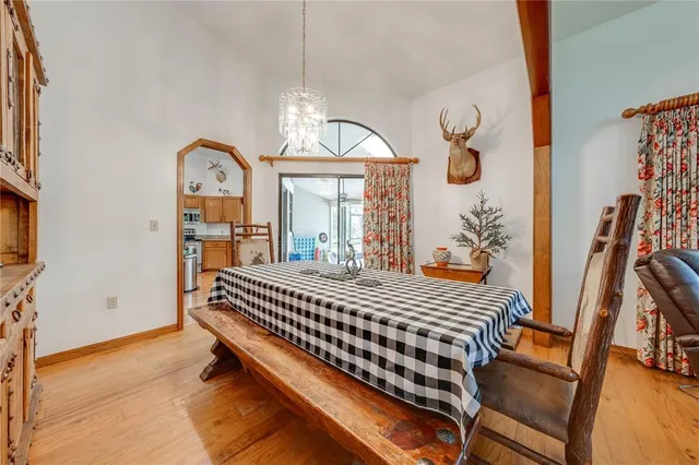 a spacious bathroom with a granite countertop sink mirror and a bathtub