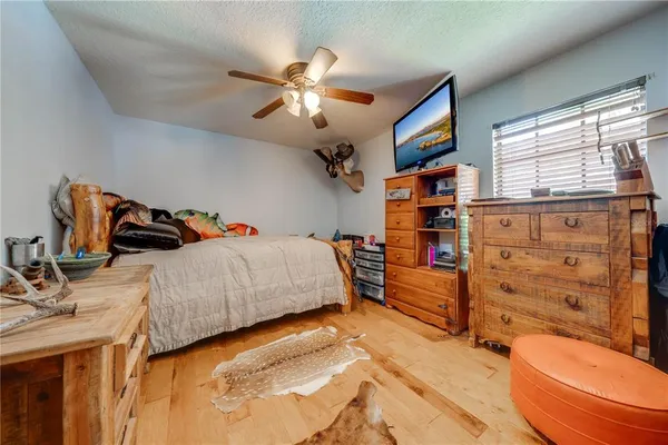 a view of a house with swimming pool and sitting area