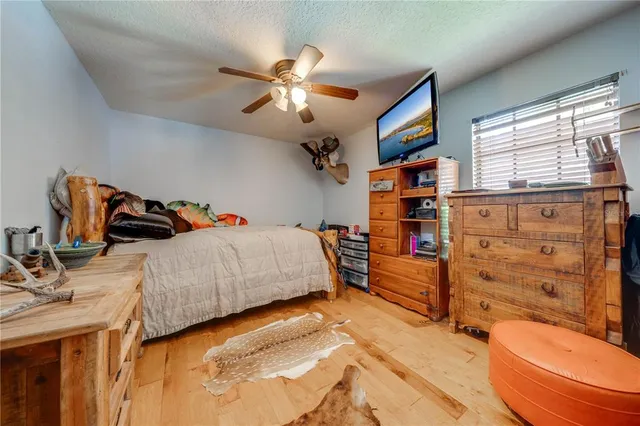 a view of a house with swimming pool and sitting area