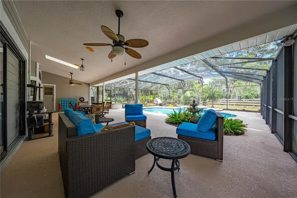 a kitchen with stainless steel appliances granite countertop a refrigerator a stove top oven a sink dishwasher and white cabinets with wooden floor