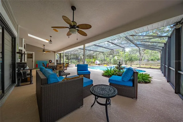 a kitchen with stainless steel appliances granite countertop a refrigerator a stove top oven a sink dishwasher and white cabinets with wooden floor