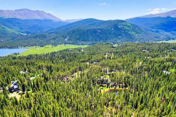 a view of mountain and a yard