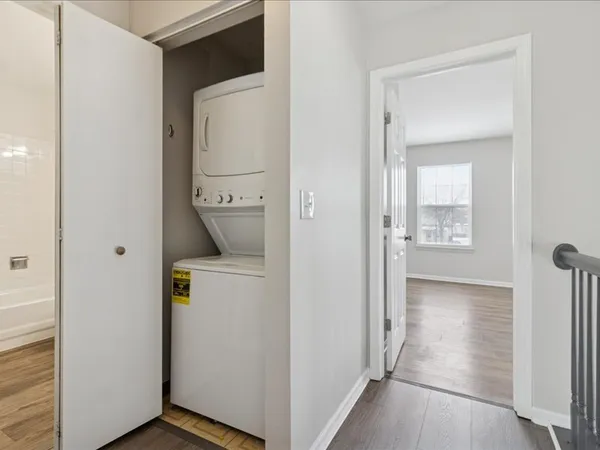 a view of an entryway with wooden floor