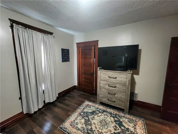 a bedroom with two beds and a window