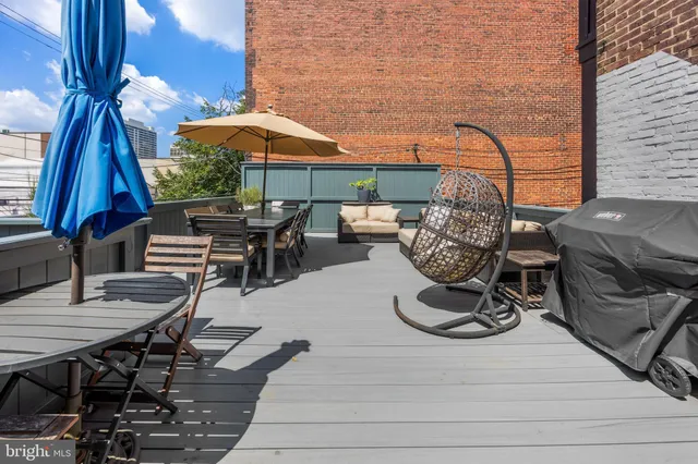 a view of a chairs and table in the patio