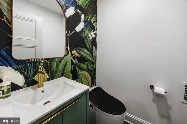 a bathroom with a sink and toilet