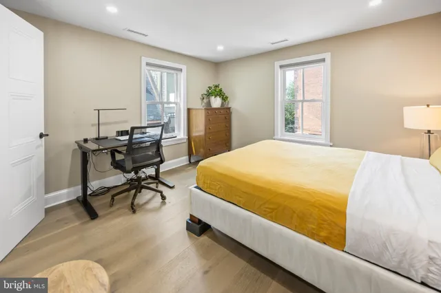 a bed room with a bed and a table