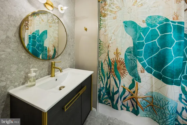 a bathroom with a sink and mirror