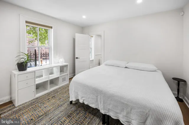 a large white bed in a white room