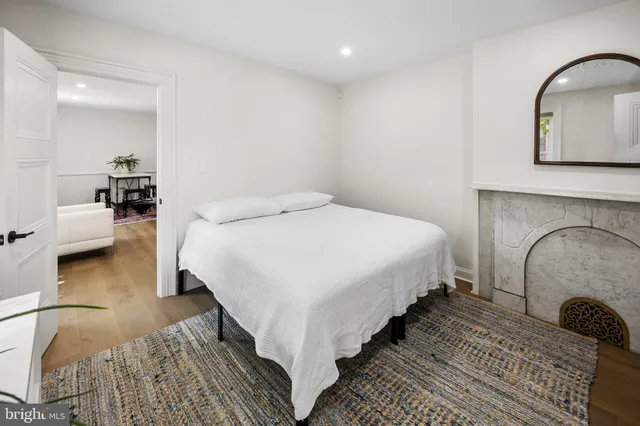 a bedroom with bed and window