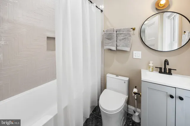 a bathroom with a toilet and a sink