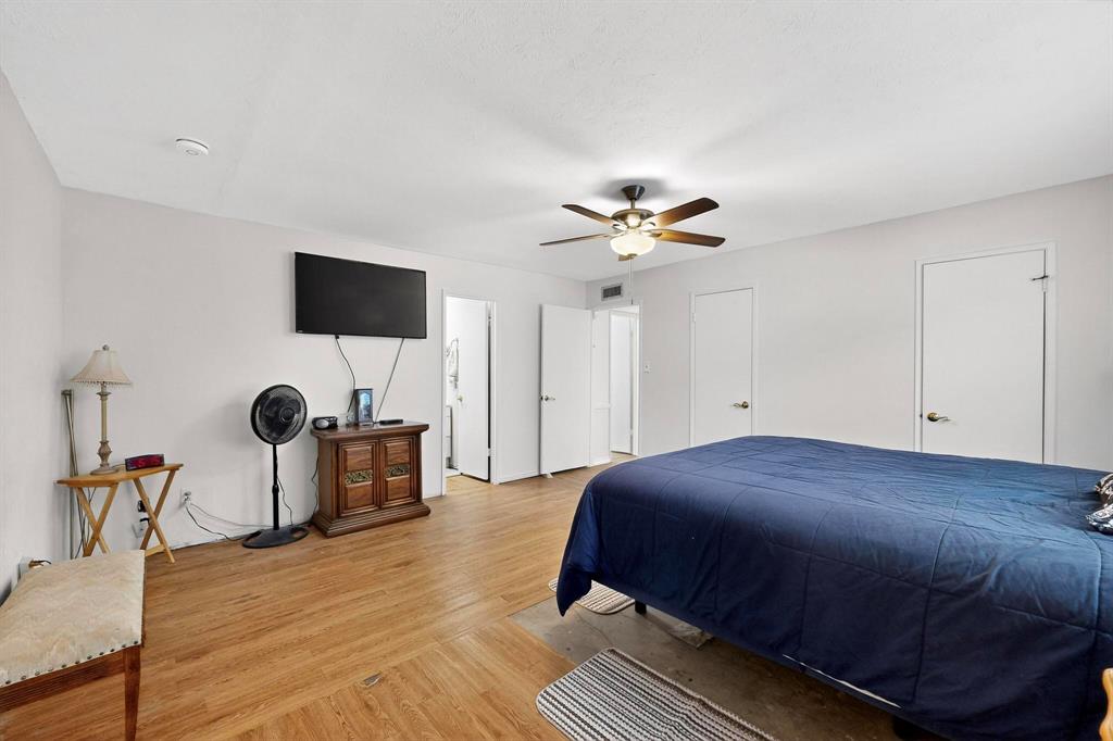 4324 Mesa View Drive Mesquite, TX 75150 - Photo 17 of 39 a bedroom with a bed and a flat screen tv