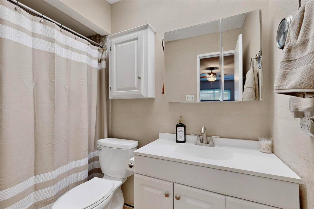 4324 Mesa View Drive Mesquite, TX 75150 - Photo 19 of 39 a bathroom with a sink toilet and shower