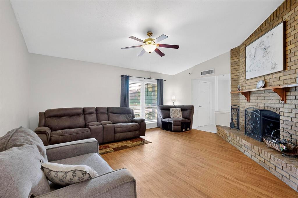 4324 Mesa View Drive Mesquite, TX 75150 - Photo 3 of 39 a living room with furniture and a fireplace