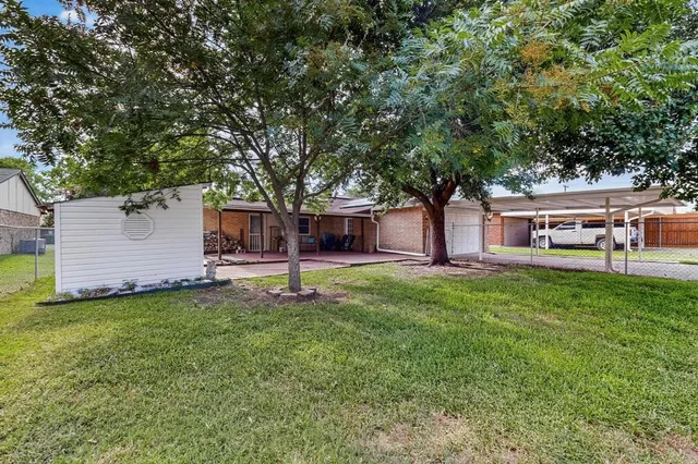 a house view with a sitting space and garden