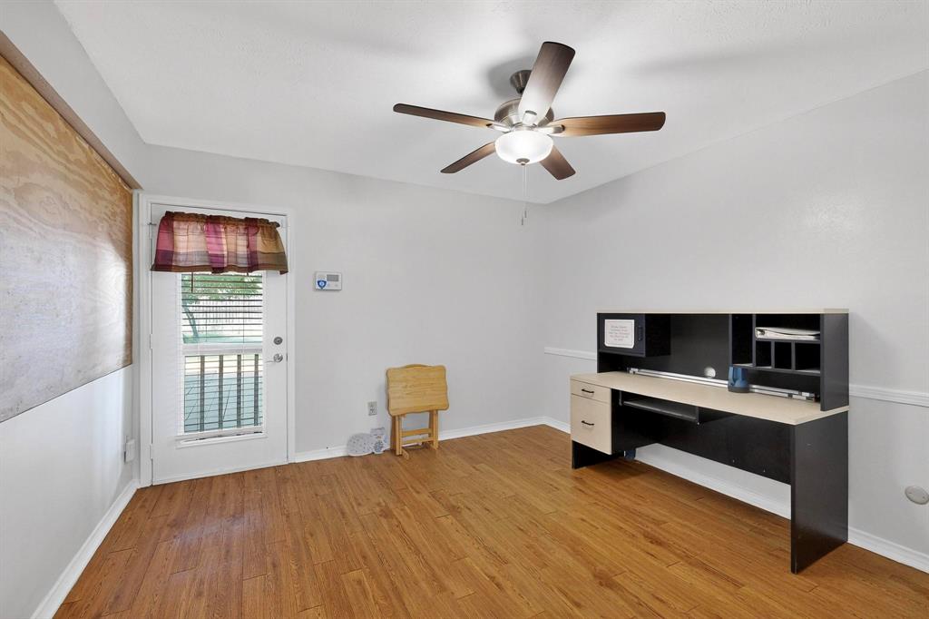 4324 Mesa View Drive Mesquite, TX 75150 - Photo 6 of 39 a bedroom with a bed and a desk