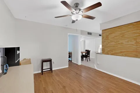a view of livingroom with furniture and workspace