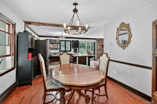 a view of a dining room with furniture window and outside view