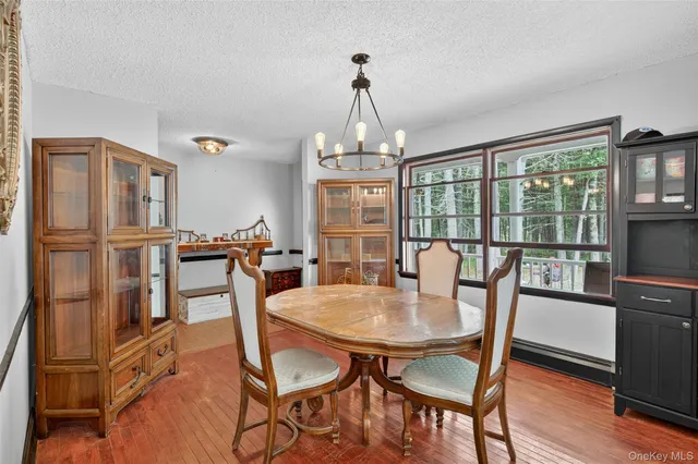 a kitchen with stainless steel appliances granite countertop a stove refrigerator and cabinets
