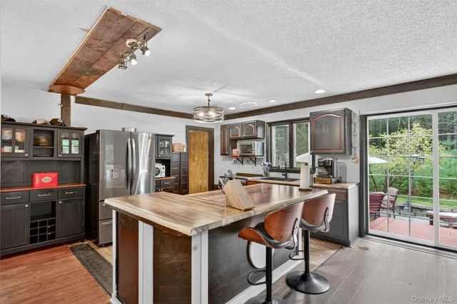 a view of a kitchen and dining room