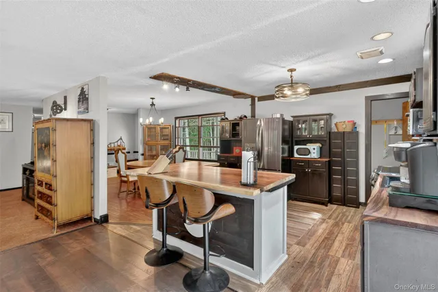 a living room with furniture and large windows