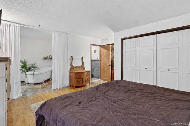 a white vase with flowers