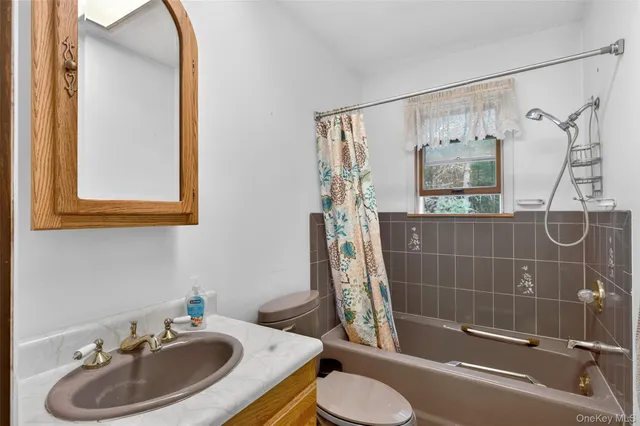 a room with lots of furniture and a chandelier