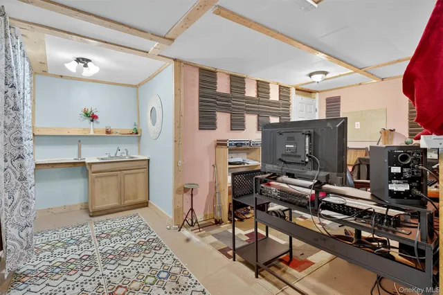 a view of a house with a yard and sitting area