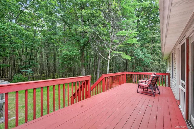 a view of a house with a yard and sitting area