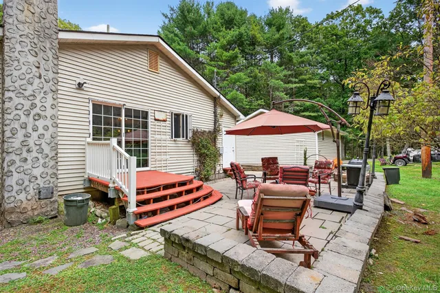 an aerial view of a house with yard