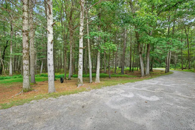 a very nice looking room with a large window and a chandelier