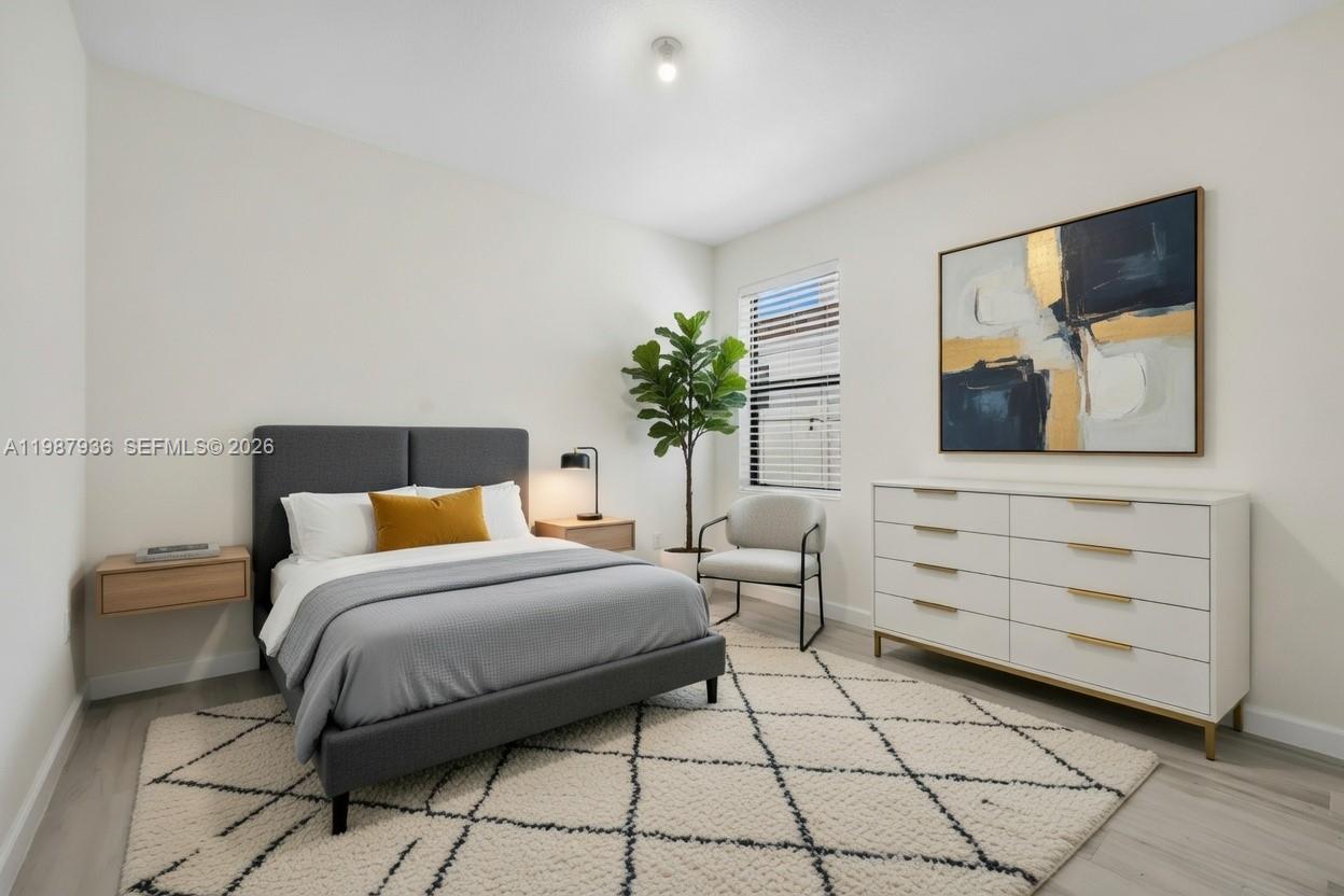 10521 West 35th Way Hialeah, FL 33018 - Photo 13 of 53 AI-staged ground floor bedroom