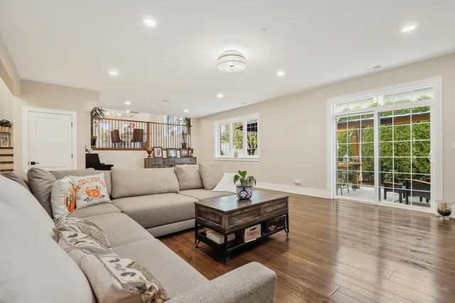a living room with furniture and windows