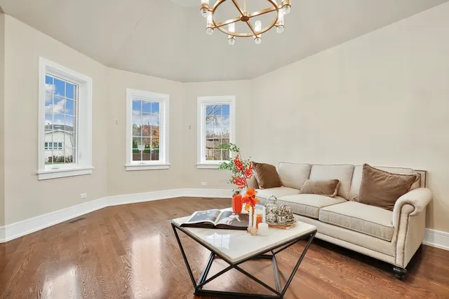 a living room with furniture and a table