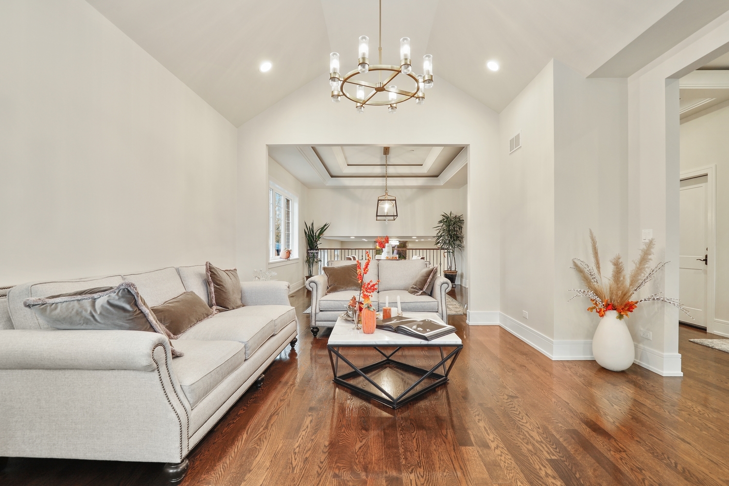 8318 West 91st Street Hickory Hills, IL 60457 - Photo 5 of 29 a living room with furniture and a chandelier