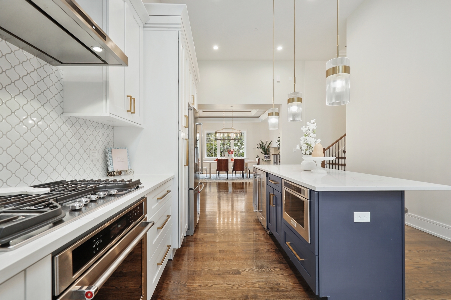 8318 West 91st Street Hickory Hills, IL 60457 - Photo 7 of 29 a kitchen with a stove and a chandelier