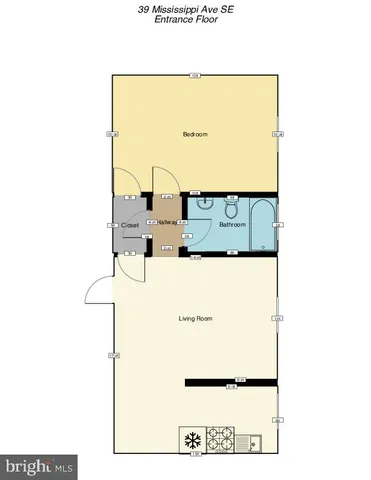 an empty room with wooden floor closet and windows