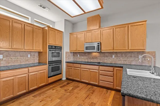 a view of a kitchen from the hallway