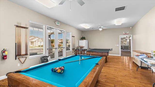 a view of a town with barn building in the background