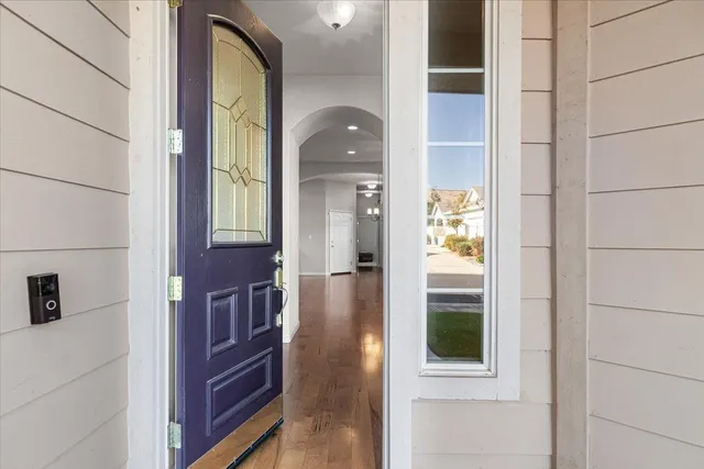 a view of a livingroom with furniture hardwood floor and a window