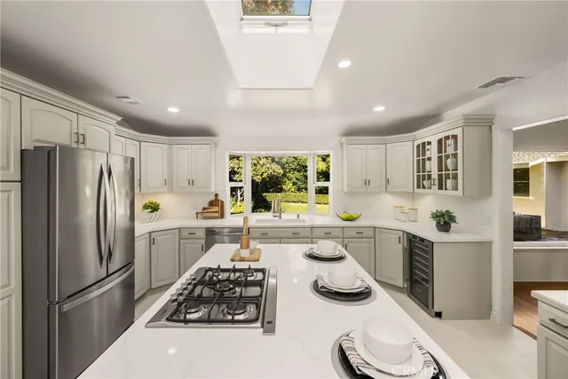 a kitchen with a sink stove and refrigerator