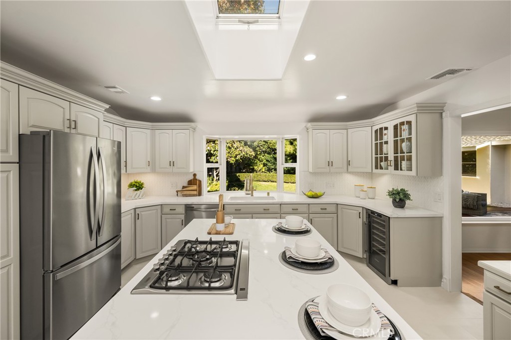 1225 Wabash Street Pasadena, CA 91103 - Photo 17 of 43 a kitchen with a sink stove and refrigerator