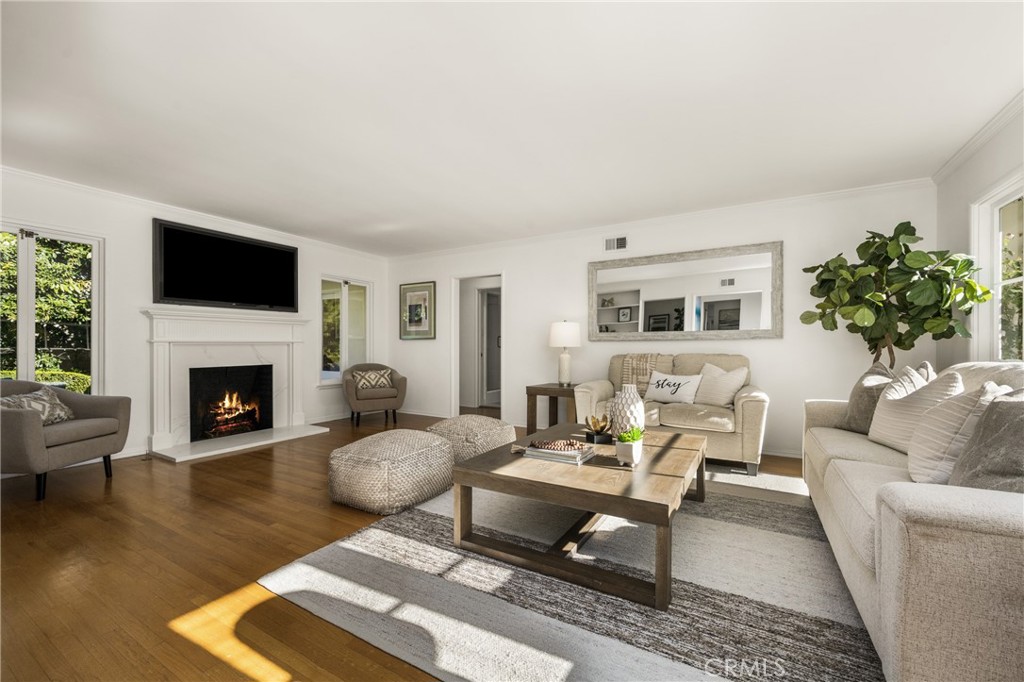 1225 Wabash Street Pasadena, CA 91103 - Photo 5 of 43 a living room with furniture a fireplace and a flat screen tv