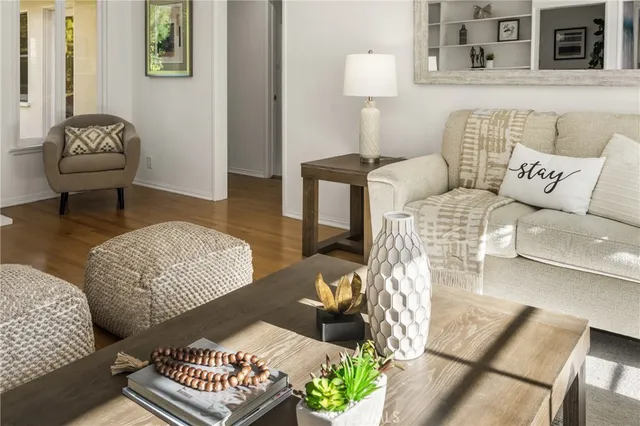 a living room with furniture and a rug