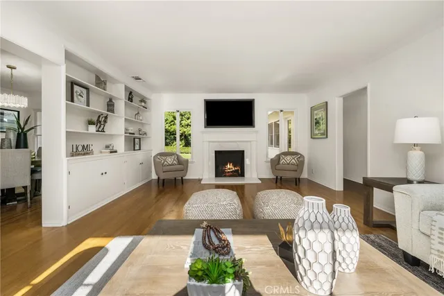 a living room with furniture fireplace and a flat screen tv