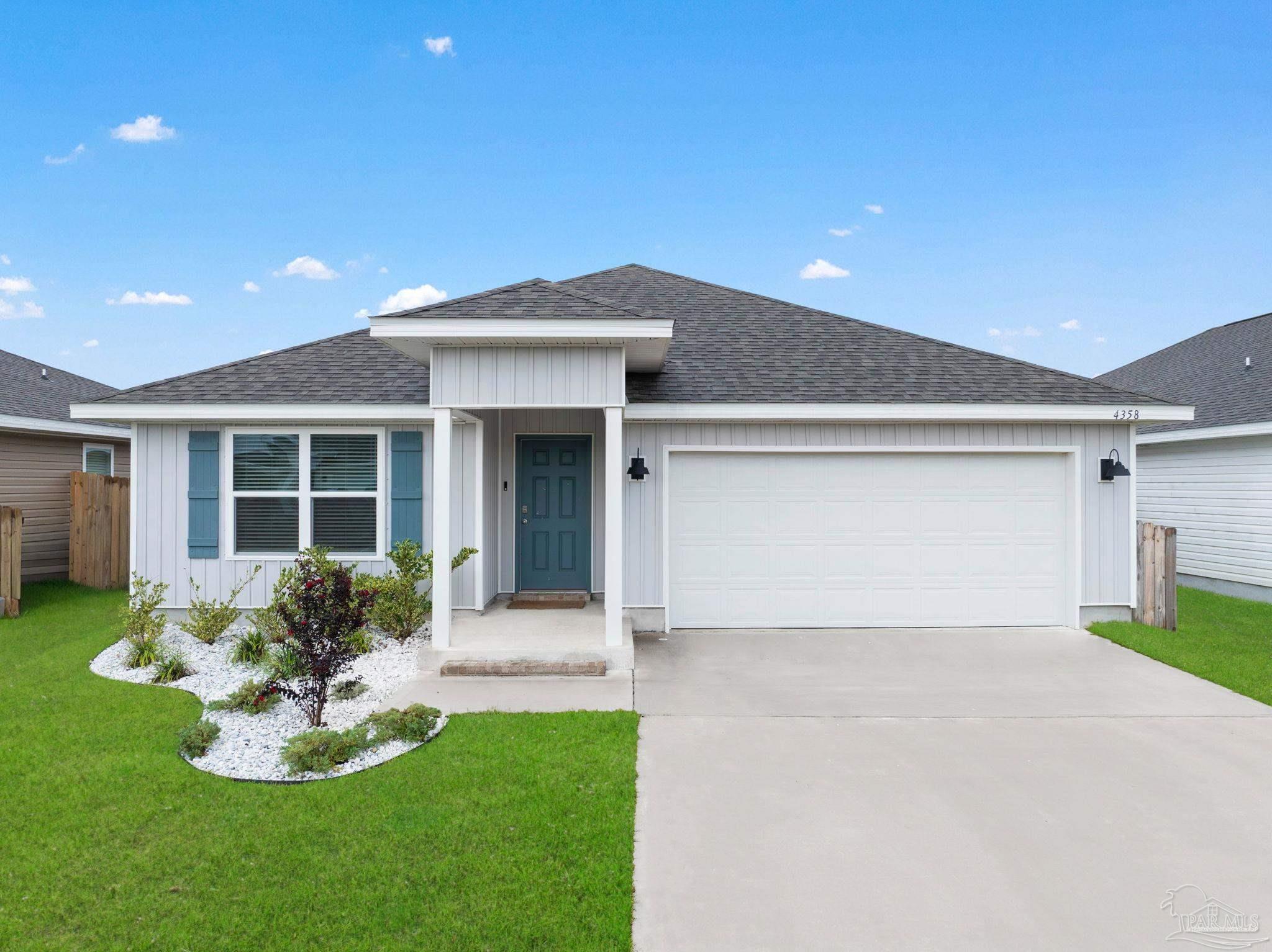 4358 Redbay Court Pace, FL 32571 - Photo 1 of 47 a front view of a house with a yard and porch