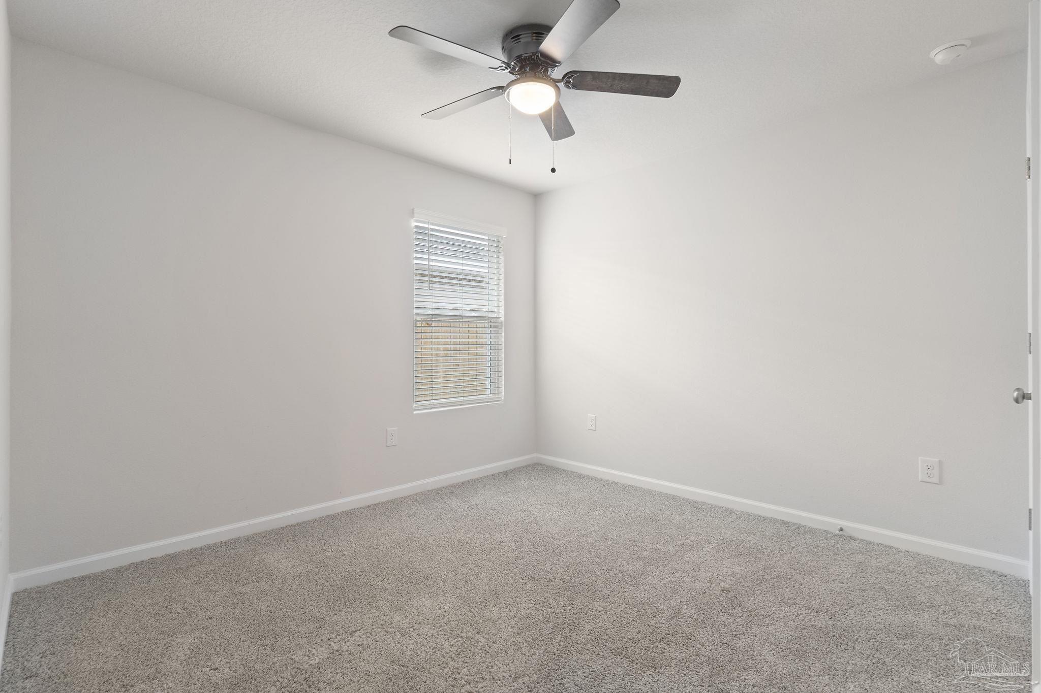 4358 Redbay Court Pace, FL 32571 - Photo 16 of 47 an empty room with a window and a fan