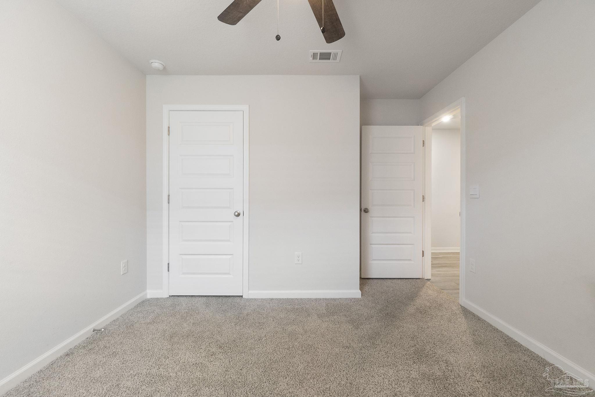 4358 Redbay Court Pace, FL 32571 - Photo 17 of 47 an empty room with closet and a ceiling fan