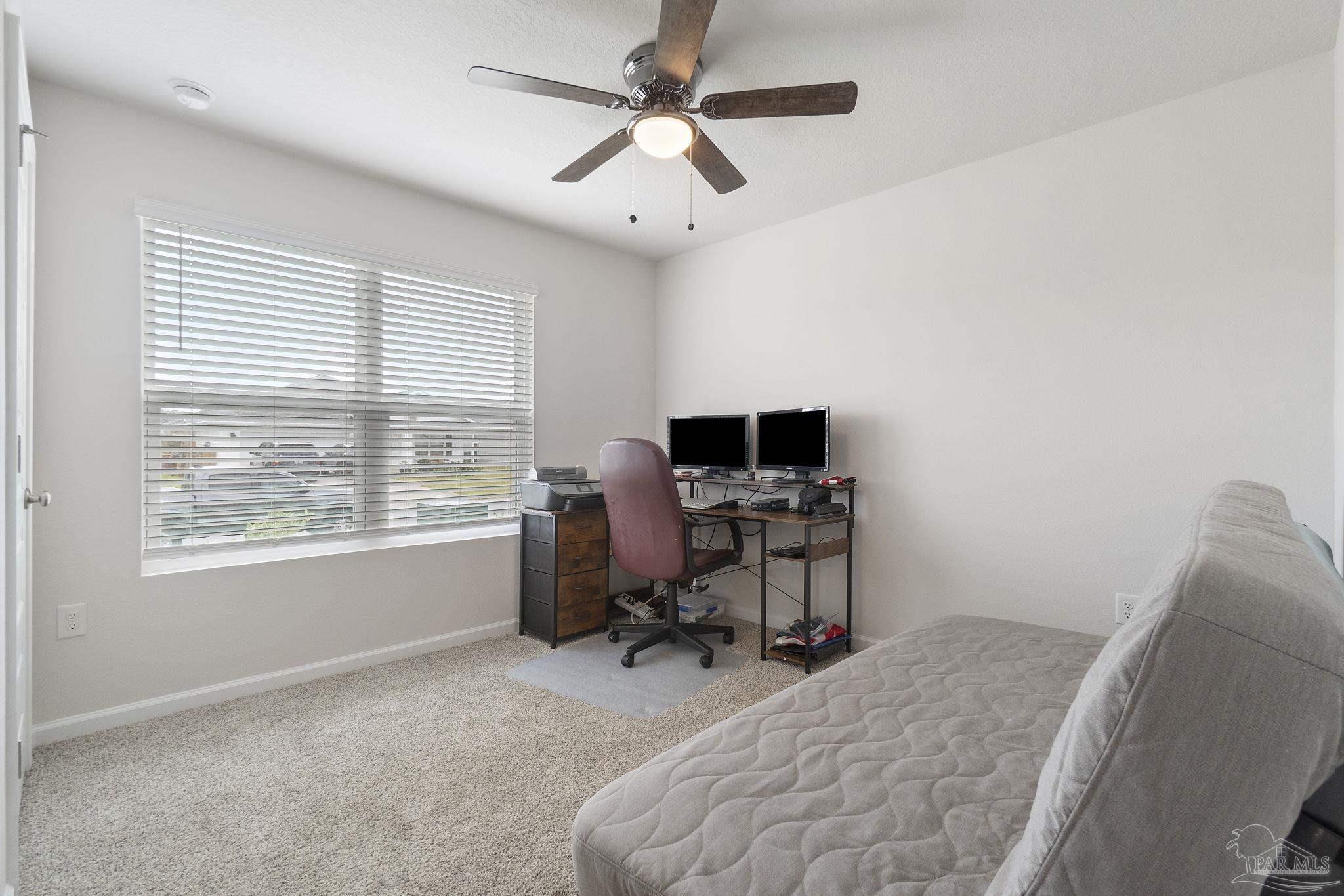 4358 Redbay Court Pace, FL 32571 - Photo 18 of 47 a view of a workspace with furniture and a window