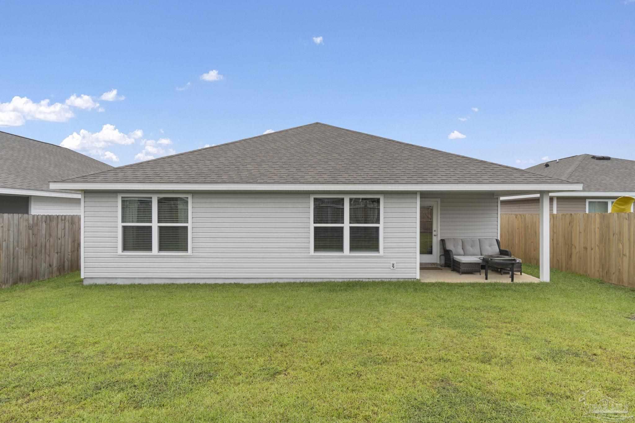 4358 Redbay Court Pace, FL 32571 - Photo 35 of 47 a house view with a garden space